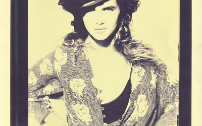 Isabelle Pasco, chemisier à fleurs et chapeau, circa 1984.